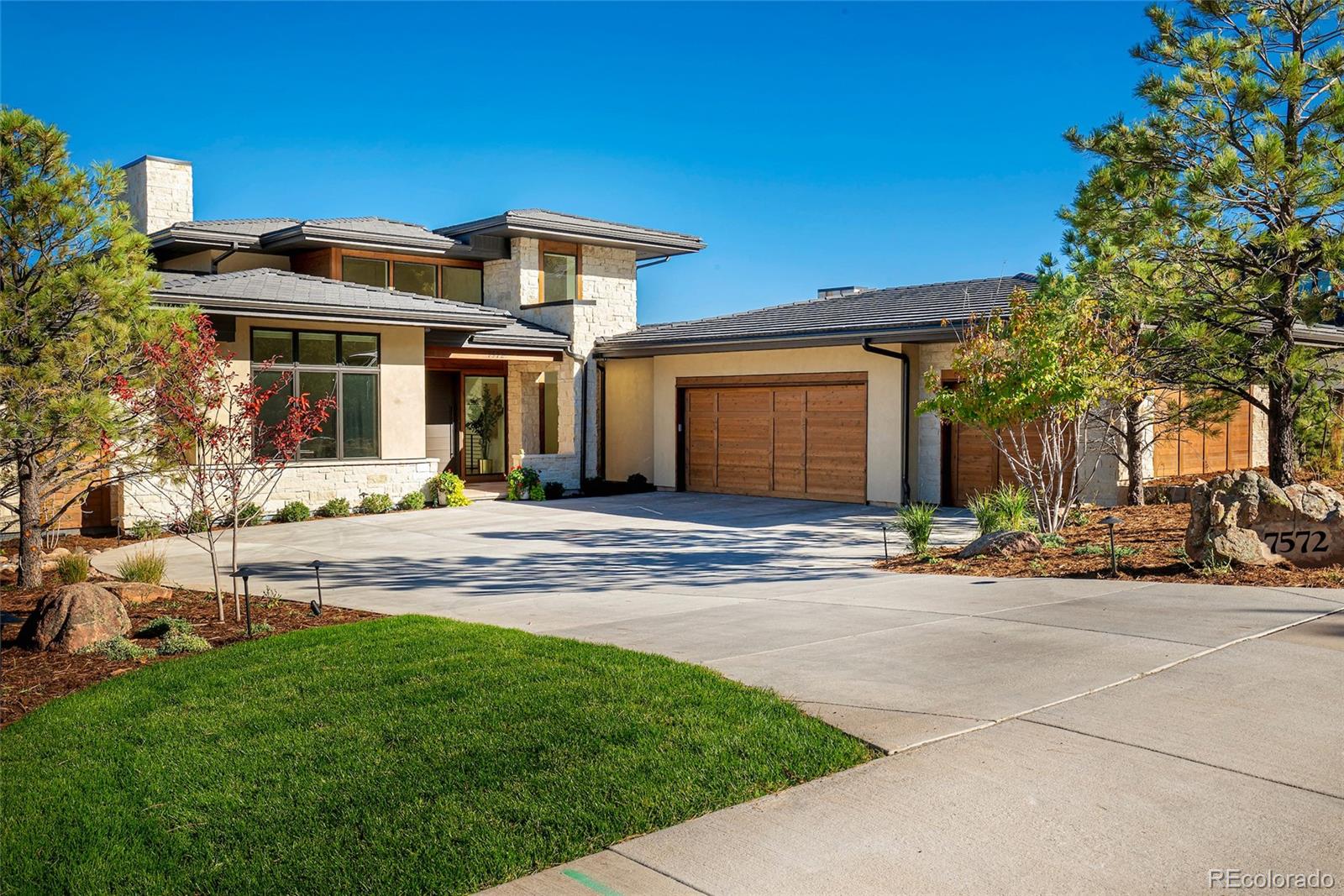 7572 Raphael Lane Littleton, CO 80125 - Photo 46 of 50 a front view of a house with a yard