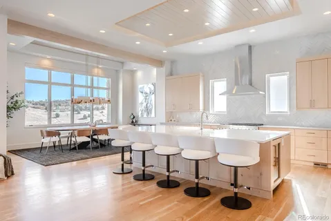 a kitchen with lots of counter top space and dining table