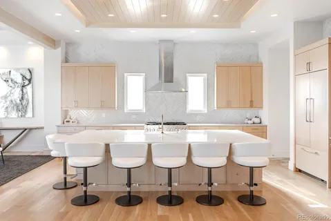 a kitchen with a sink and white cabinets
