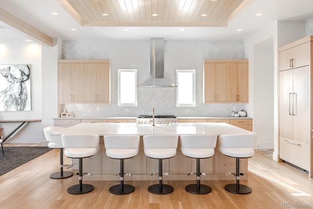 a kitchen with a sink and white cabinets