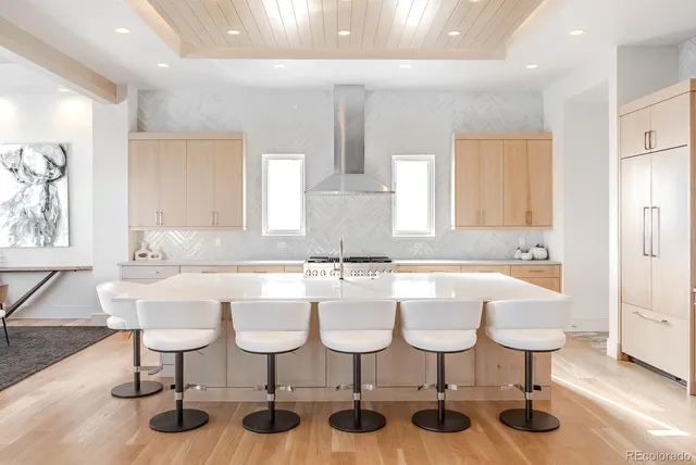 a kitchen with a sink and white cabinets