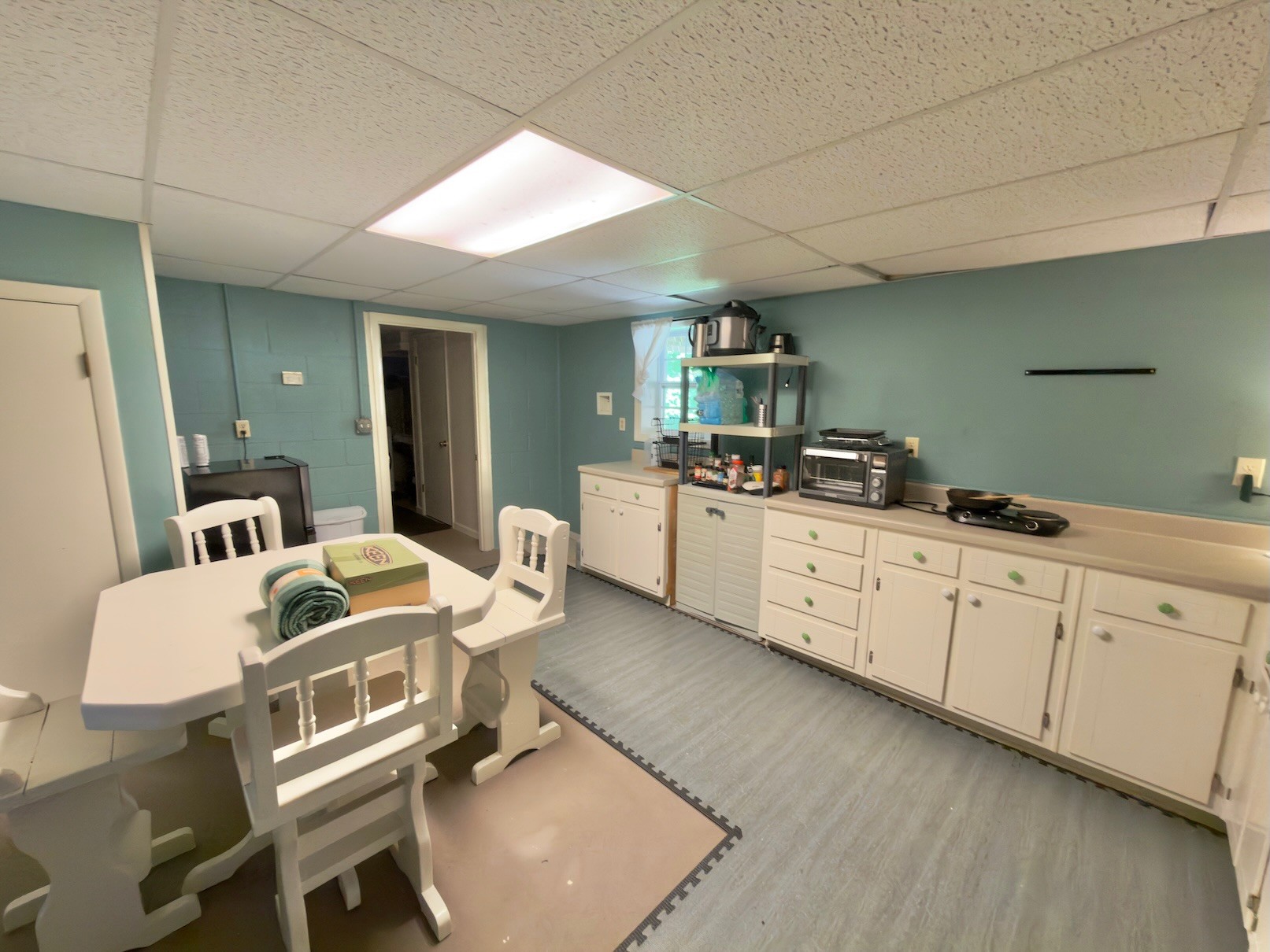 3080 Pleasant Ridge Road Woodbury, TN 37190 - Photo 17 of 19 a kitchen with a sink and chairs