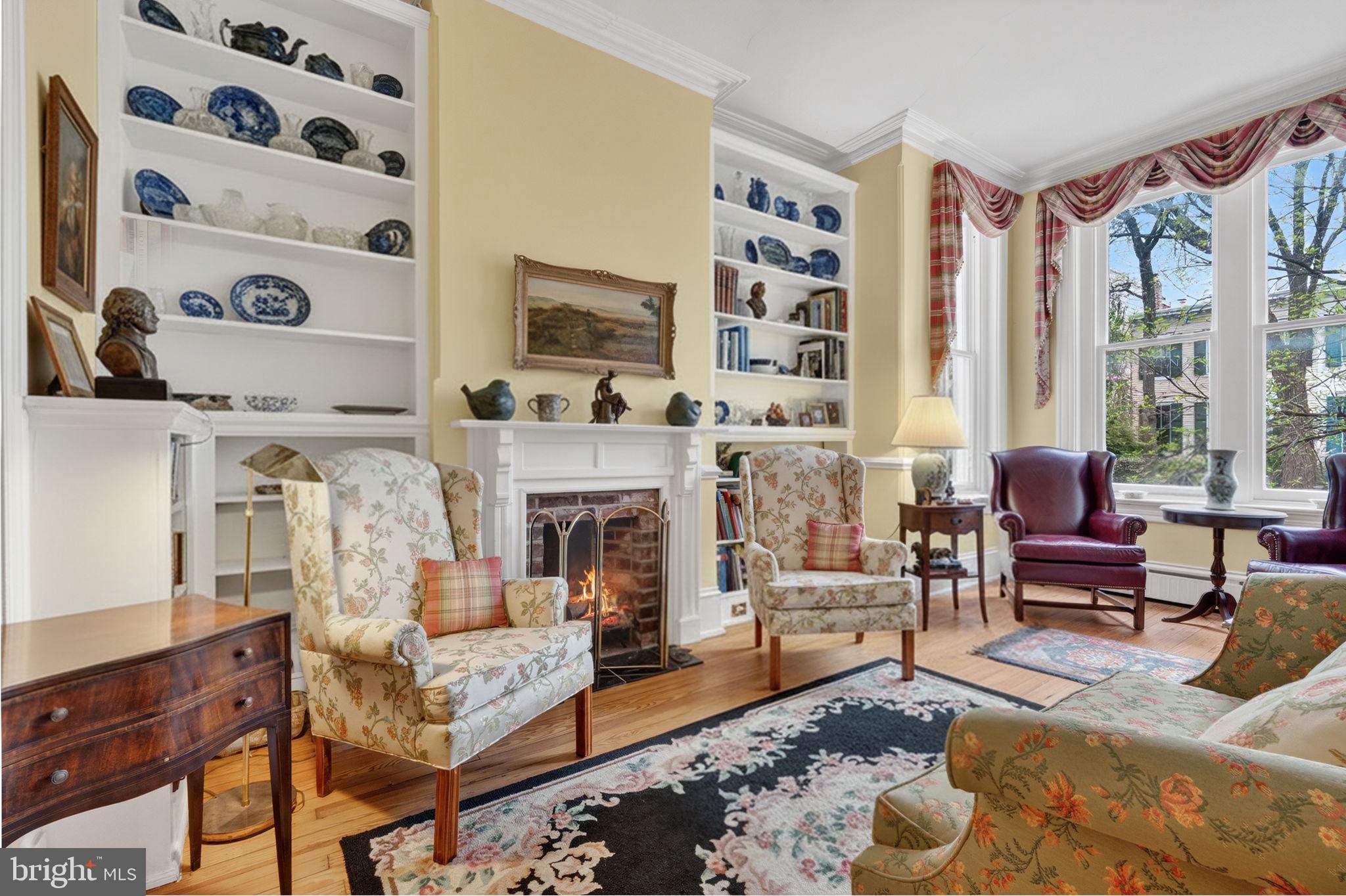 a living room with furniture fireplace and window