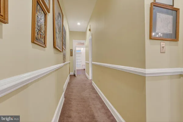 a view of a hallway with staircase