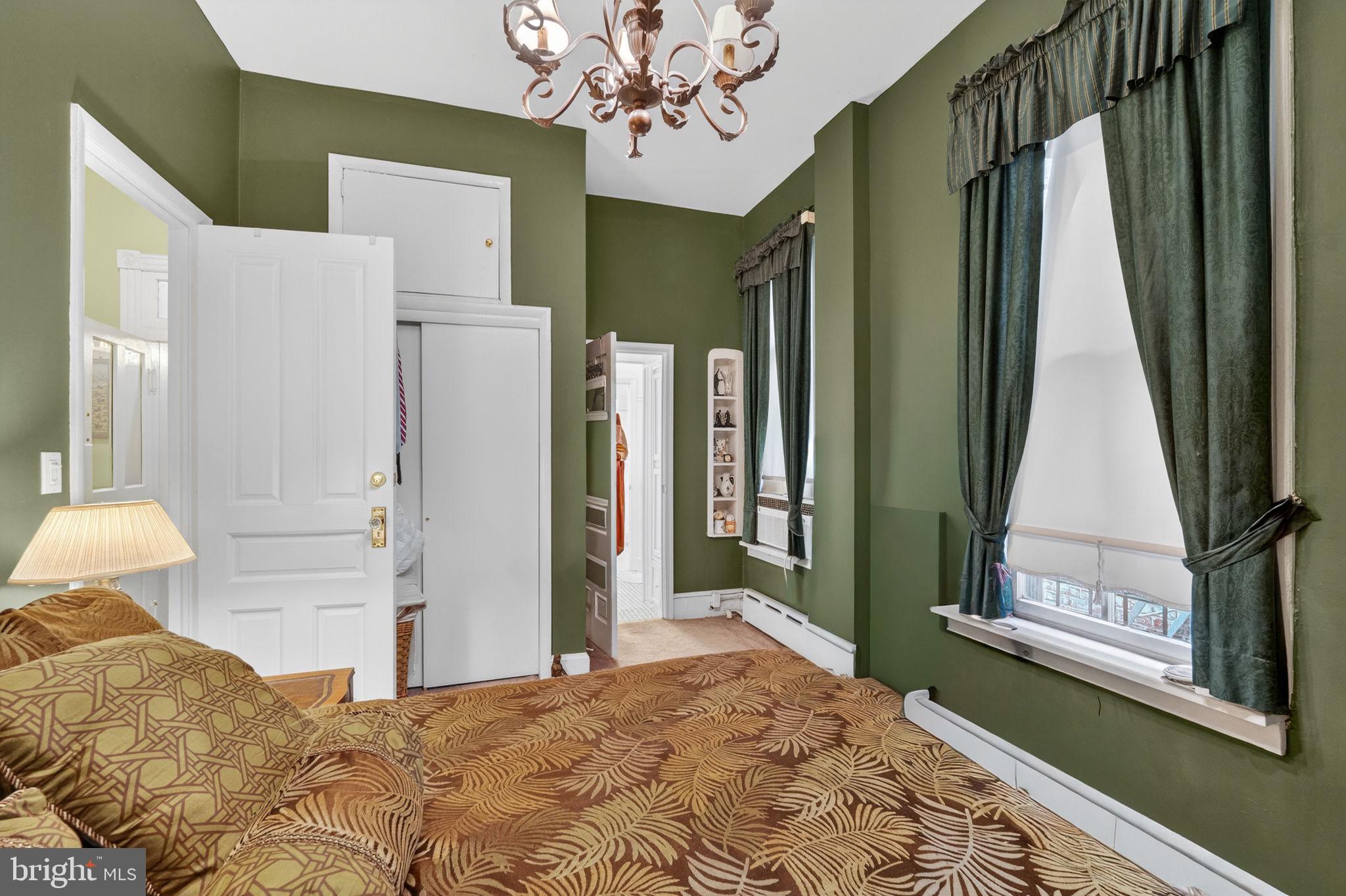 15 3rd Street Northeast, Unit 2 Washington, DC 20002 - Photo 22 of 32 a bedroom with a bed and a dresser