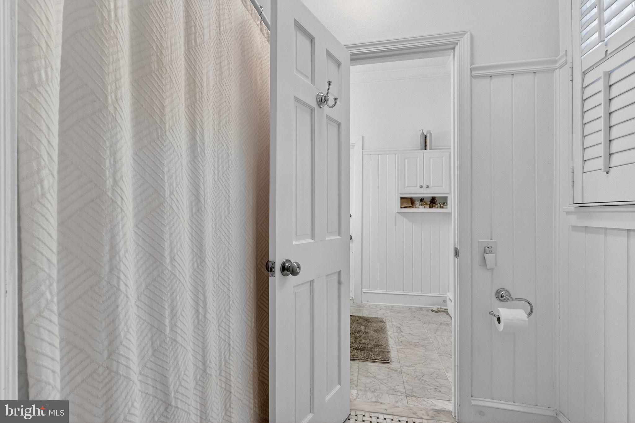 15 3rd Street Northeast, Unit 2 Washington, DC 20002 - Photo 25 of 32 a bathroom with a shower and a glass door