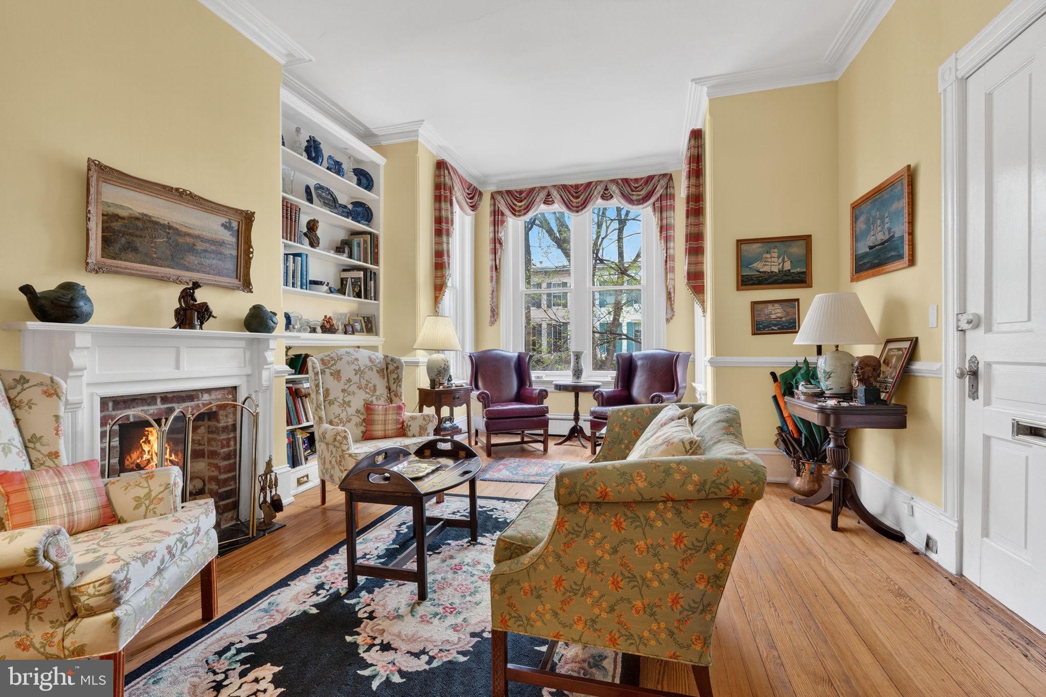 15 3rd Street Northeast, Unit 2 Washington, DC 20002 - Photo 8 of 32 a living room with furniture a fireplace and a large window