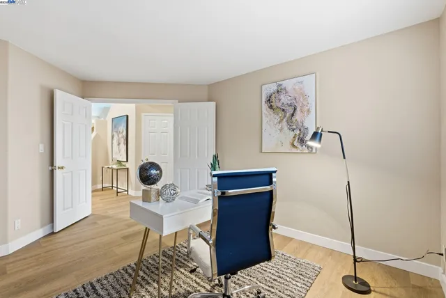 a workspace with furniture and wooden floor