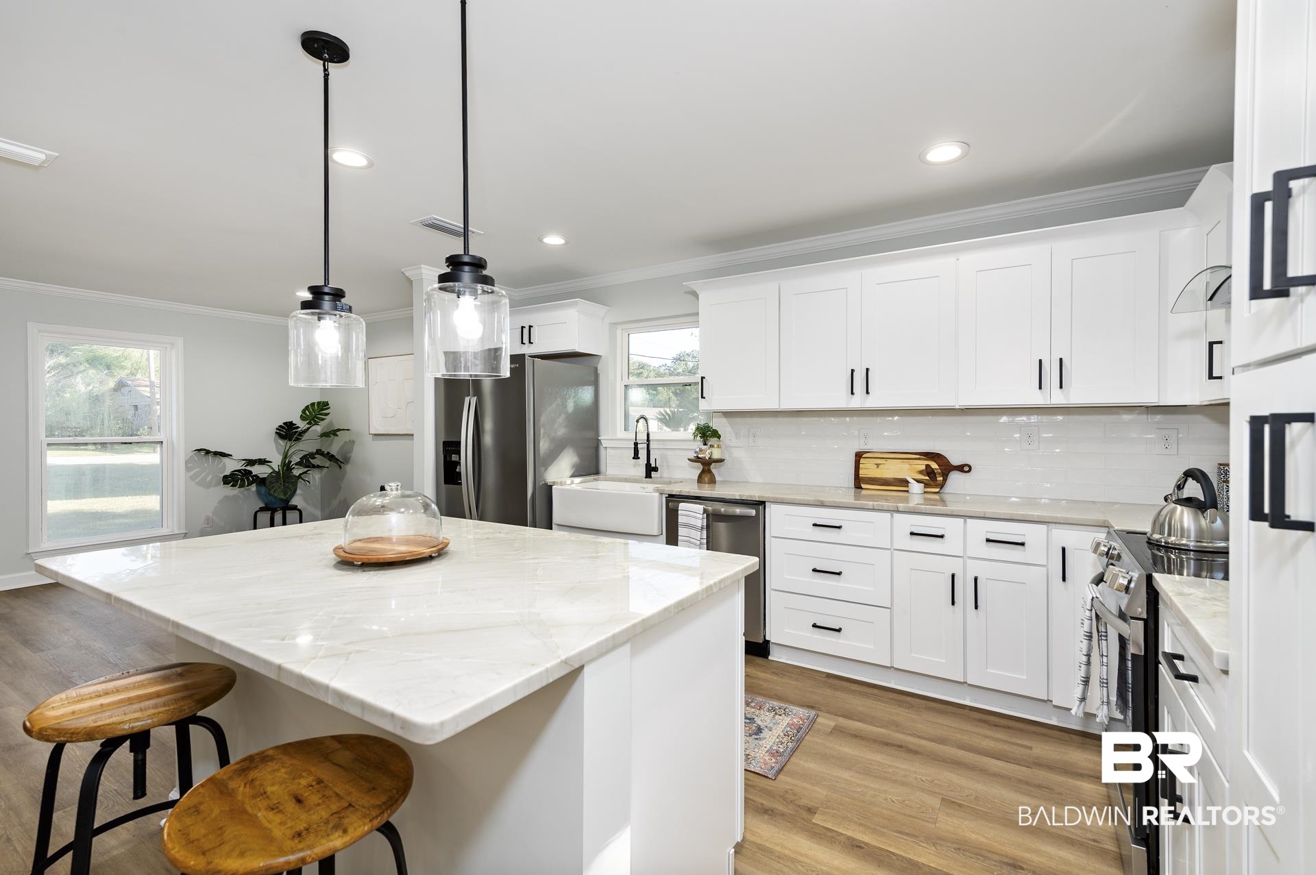 6001 Camp Halls Mill Road Mobile, AL 36619 - Photo 14 of 52 Kitchen featuring ornamental molding, a breakfast bar, stainless steel appliances, a center island, and tasteful backsplash