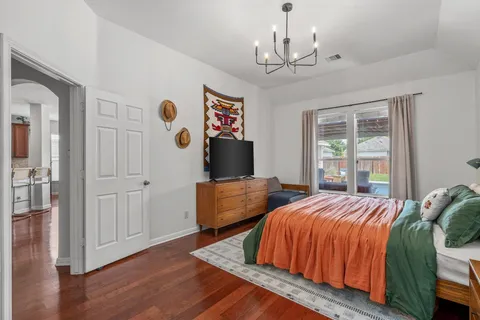 a bedroom with bed and window