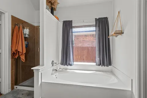 a bathroom with a bathtub and a sink