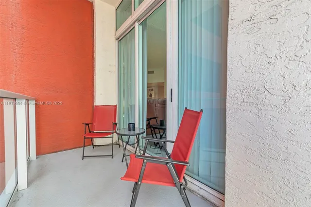 a view of a balcony with chairs