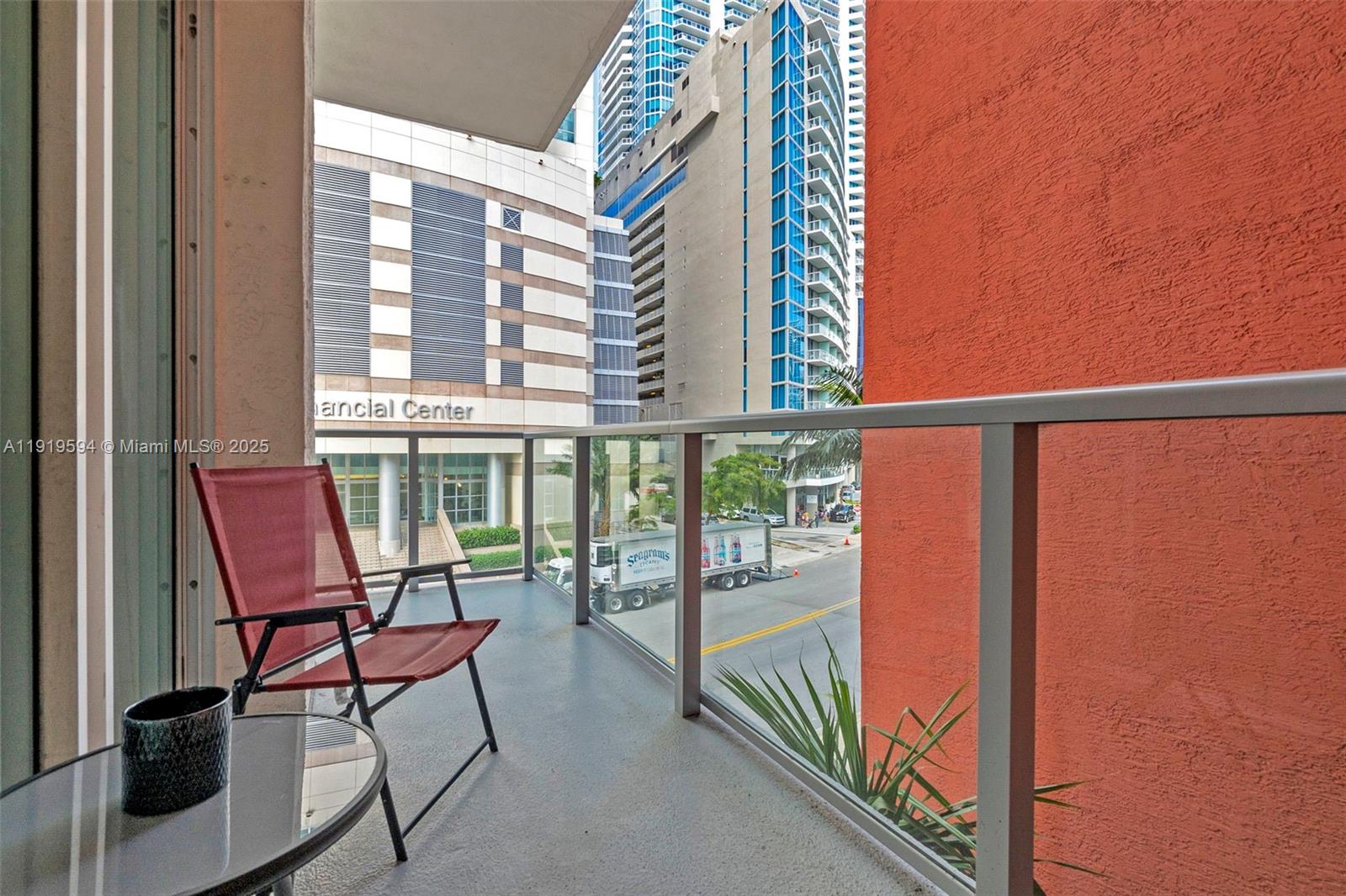 1155 Brickell Bay Drive, Unit 202 Miami, FL 33131 - Photo 32 of 46 a view of a balcony with chairs