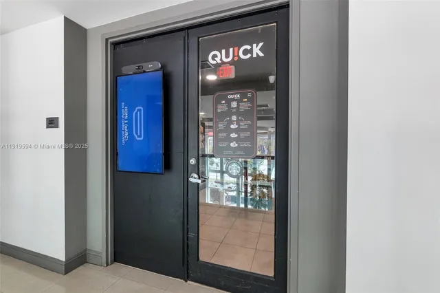 a view of living room with furniture and a large window