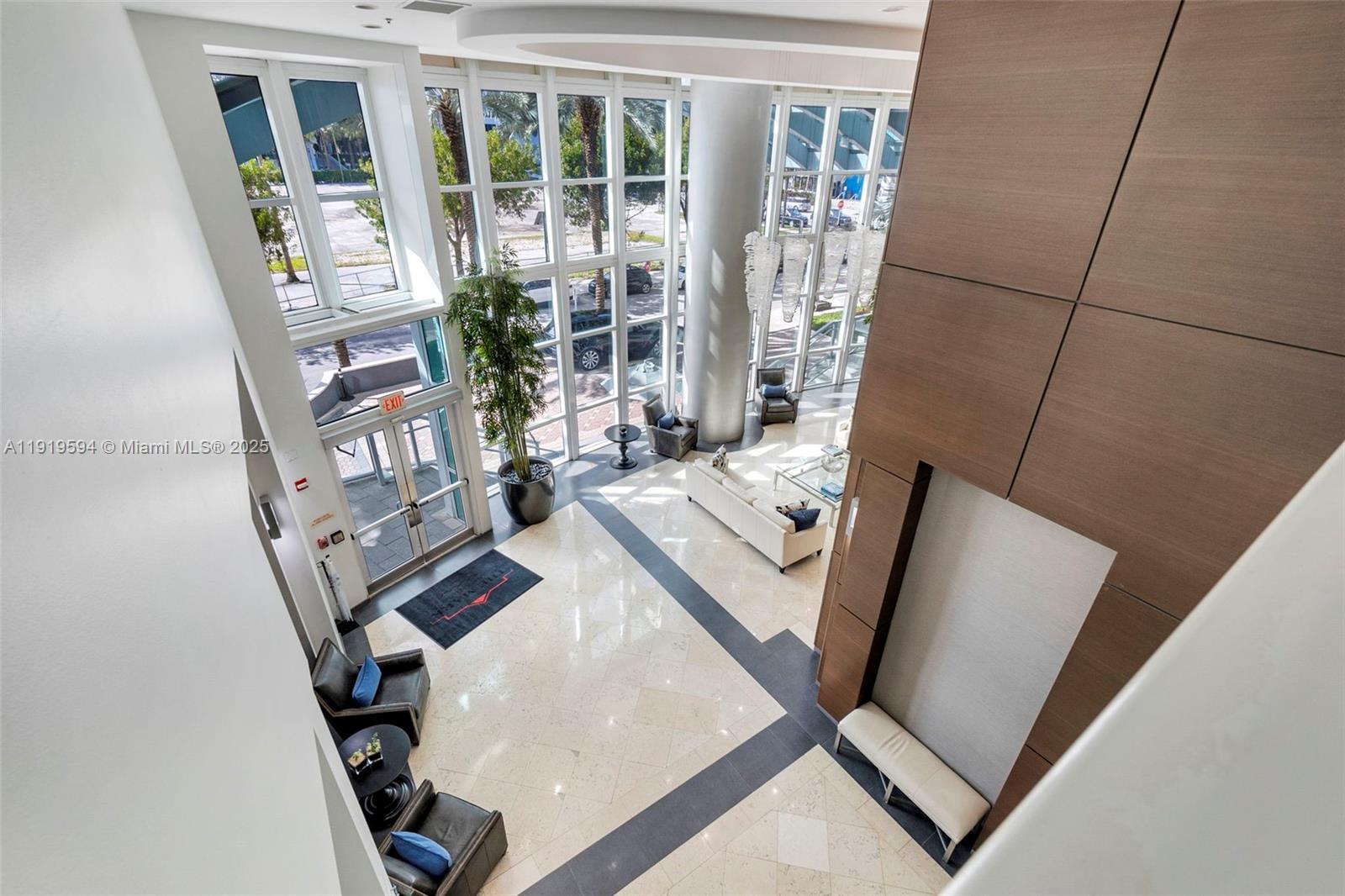 1155 Brickell Bay Drive, Unit 202 Miami, FL 33131 - Photo 36 of 46 a view of living room with furniture and a large window