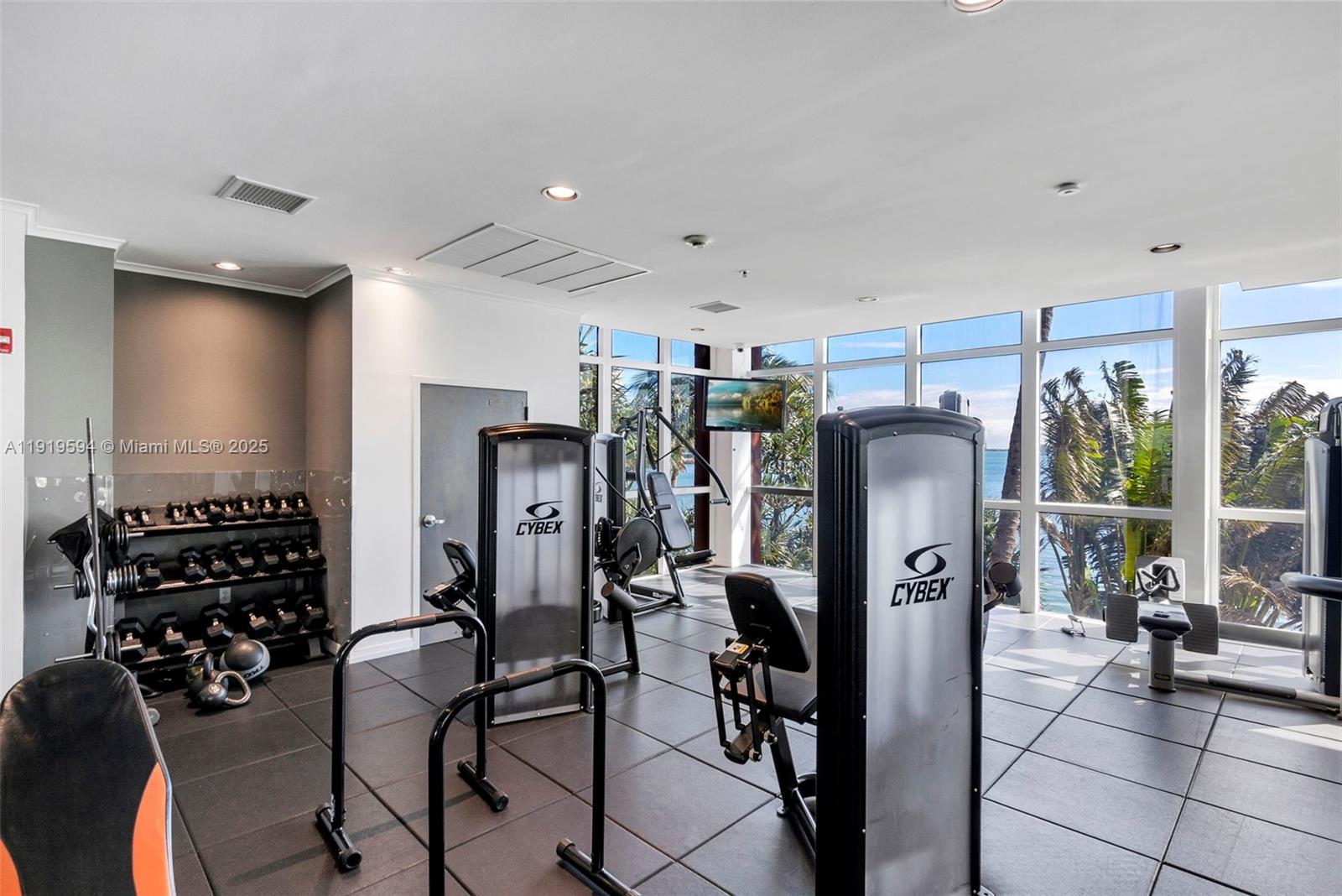 1155 Brickell Bay Drive, Unit 202 Miami, FL 33131 - Photo 39 of 46 a view of a livingroom with furniture and windows