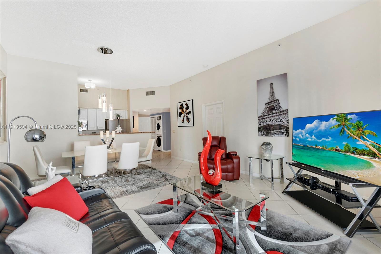 1155 Brickell Bay Drive, Unit 202 Miami, FL 33131 - Photo 9 of 46 a living room with furniture and a flat screen tv