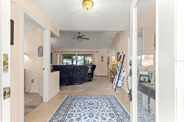 a view of entryway with a rug and front door