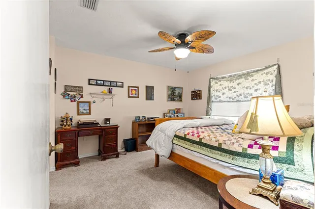 a bedroom with a bed and dresser