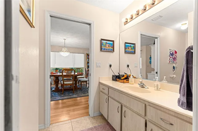 a en suite bathroom with double sink and a mirror