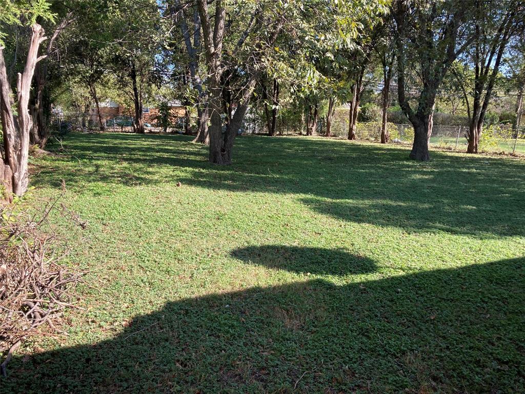 3608 South Marsalis Avenue Dallas, TX 75216 - Photo 2 of 6 a view of a golf course with a garden