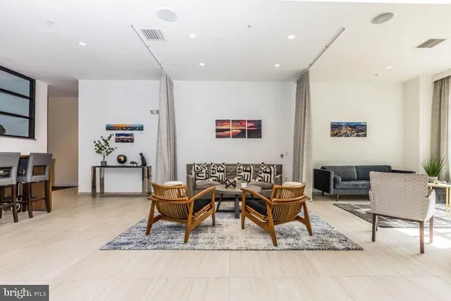 a bedroom with furniture and a rug