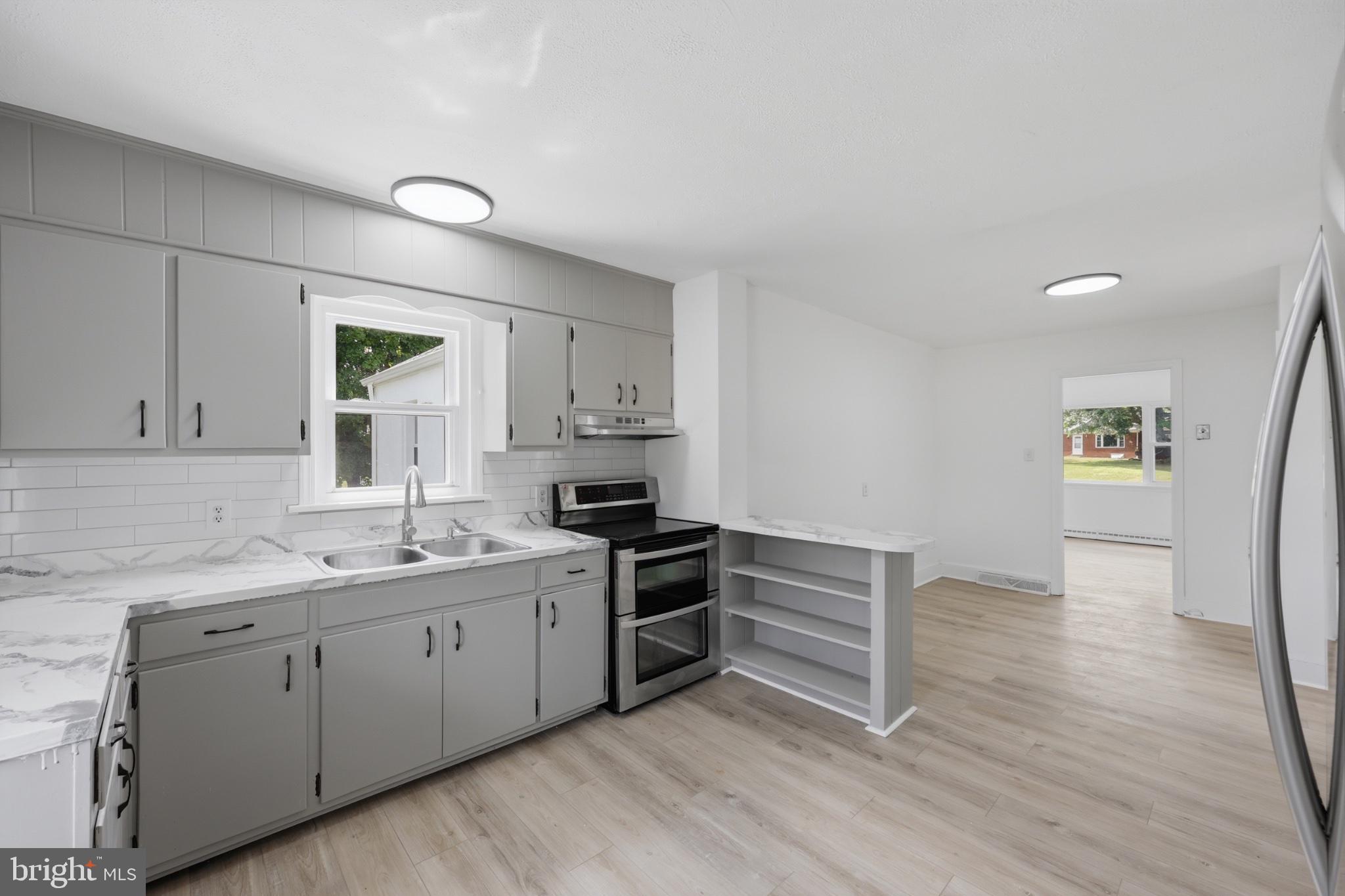 8251 Marshall Corner Road Pomfret, MD 20675 - Photo 9 of 20 Modern kitchen with sleek finishes.