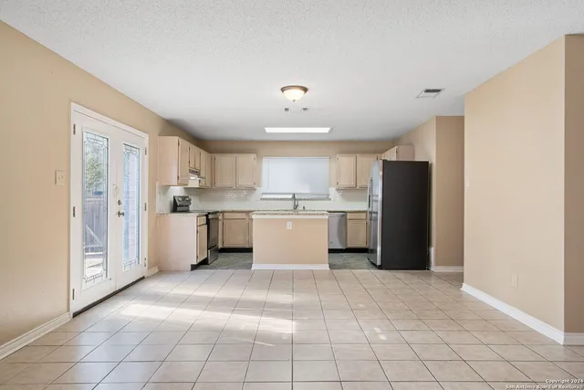 a view of a kitchen with electric appliances