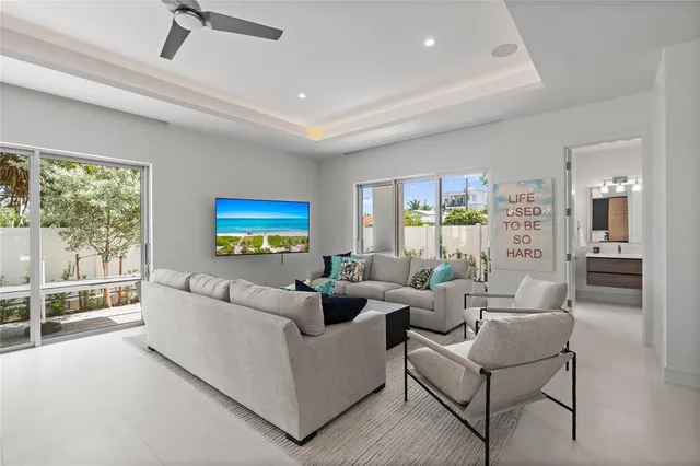 a view of a living room and chandelier