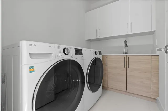 a bed sitting in a spacious bedroom next to a window