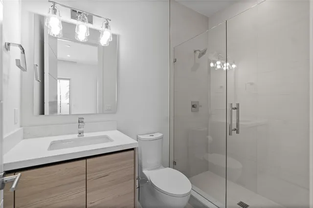 a spacious bedroom with a bed and large window