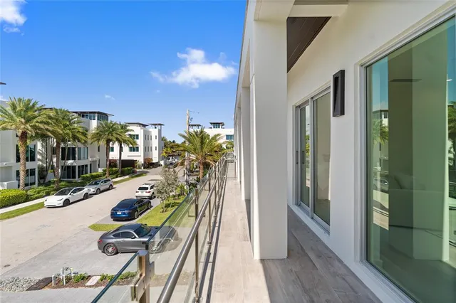 a view of a chairs and table in a balcony
