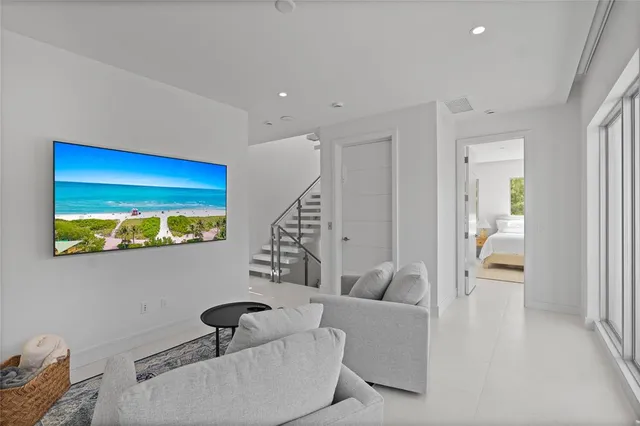 a spacious bathroom with a double vanity sink mirror and bathtub