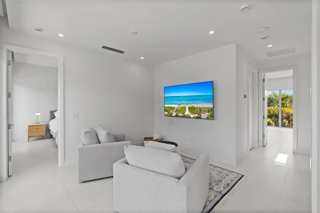 a white bath tub sitting next to a shower