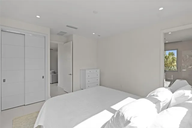 a living room with furniture and a ceiling fan