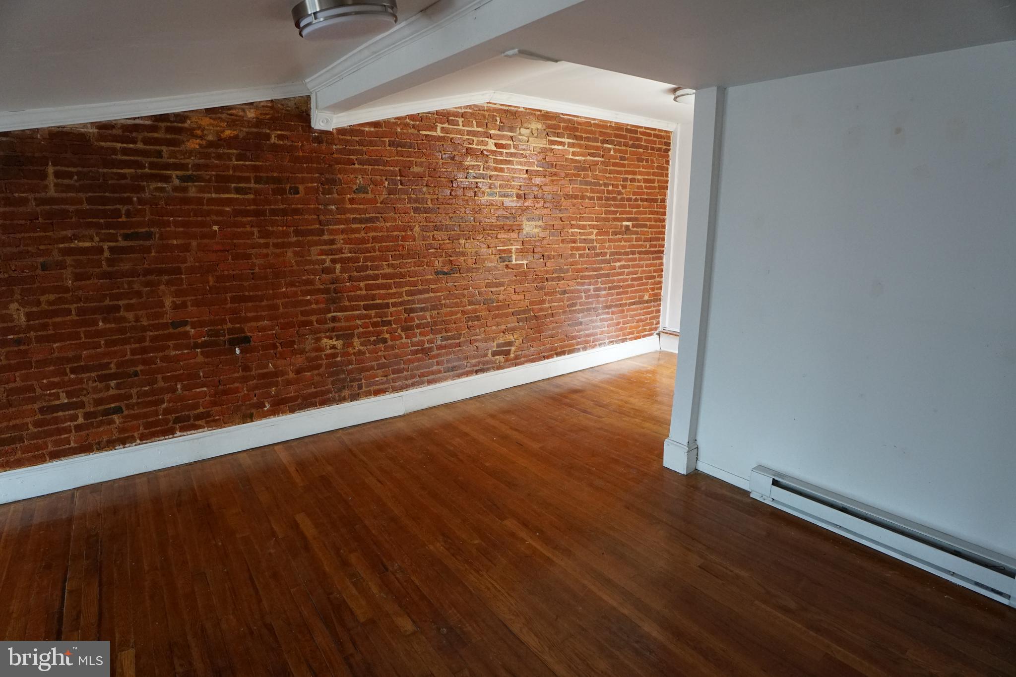 802 Cathedral Street, Unit 4 Baltimore, MD 21201 - Photo 8 of 15 a view of wooden floor