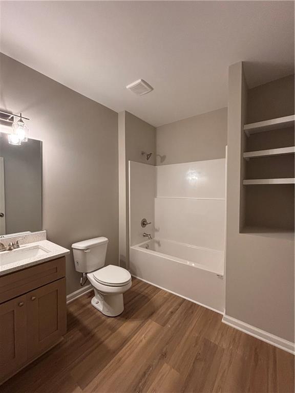 1034 Whippoorwill Road Monticello, GA 31064 - Photo 15 of 18 a bathroom with a granite countertop sink toilet a large mirror and shower