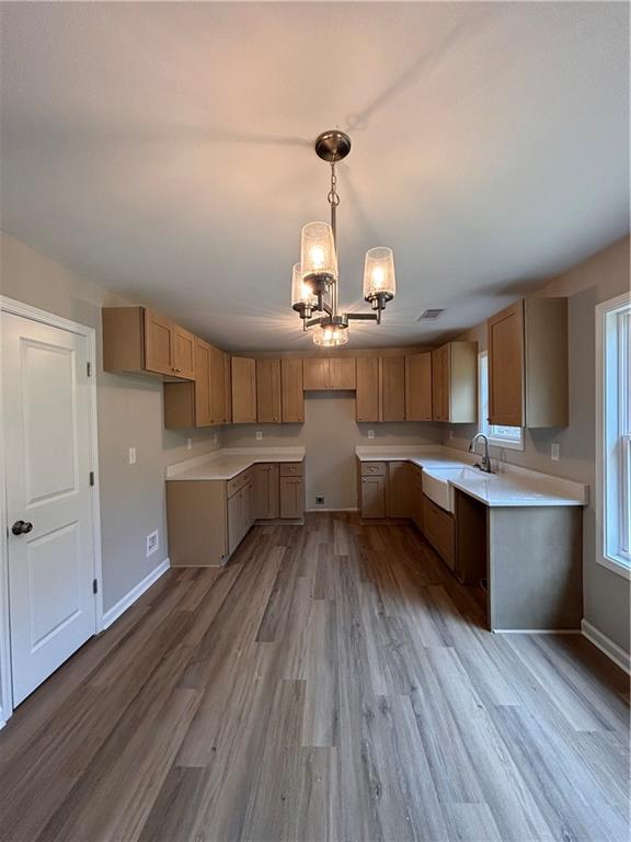 1034 Whippoorwill Road Monticello, GA 31064 - Photo 5 of 18 a kitchen with stainless steel appliances granite countertop a sink dishwasher and a stove with wooden floors