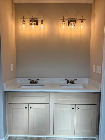 a bathroom with a sink and vanity