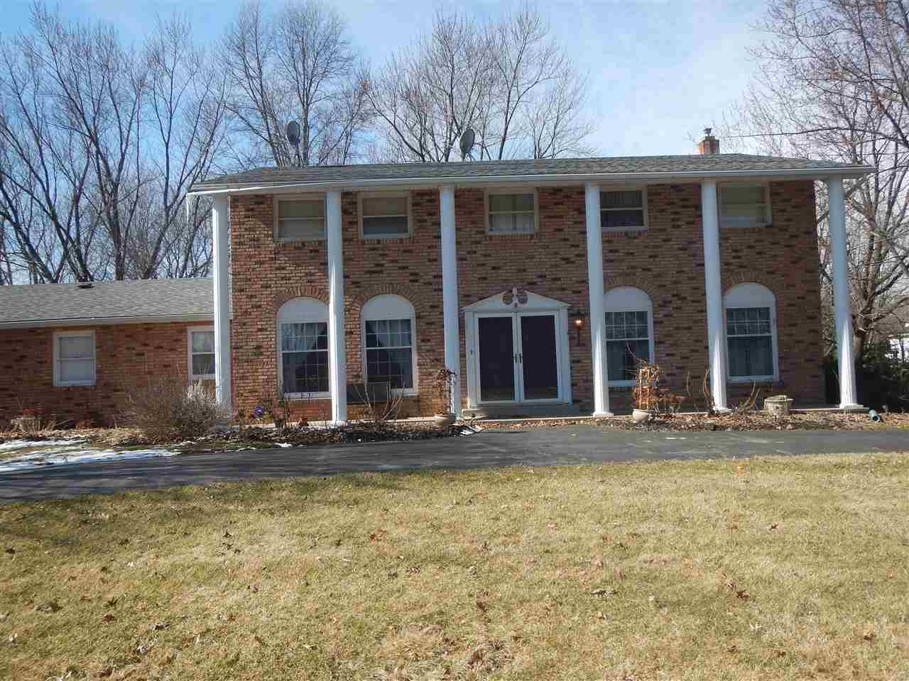 2675 South Weldon Road Winnebago, IL 61088 - Photo 1 of 19 a front view of house with yard