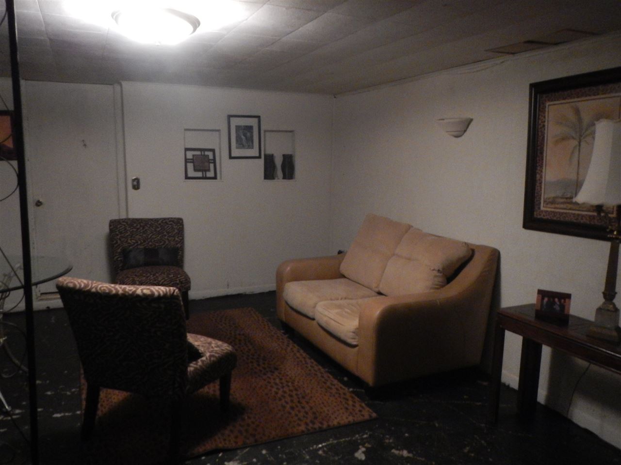 2675 South Weldon Road Winnebago, IL 61088 - Photo 12 of 19 a living room with furniture and a black door