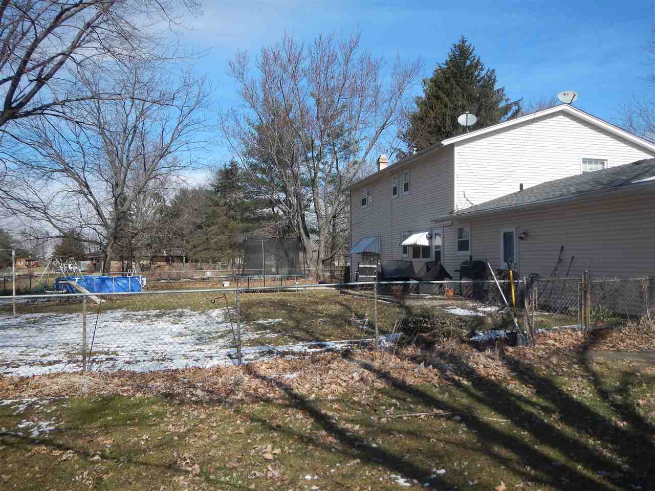 2675 South Weldon Road Winnebago, IL 61088 - Photo 17 of 19 a view of a yard with trees