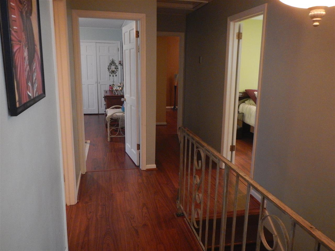 2675 South Weldon Road Winnebago, IL 61088 - Photo 5 of 19 a view of a hallway with wooden floor and a living room