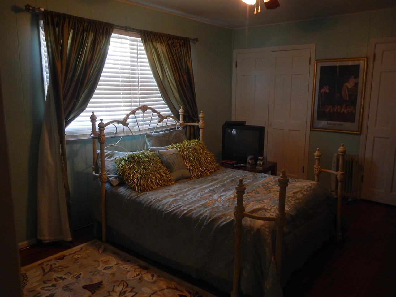 2675 South Weldon Road Winnebago, IL 61088 - Photo 9 of 19 a bed sitting in a bedroom next to a window