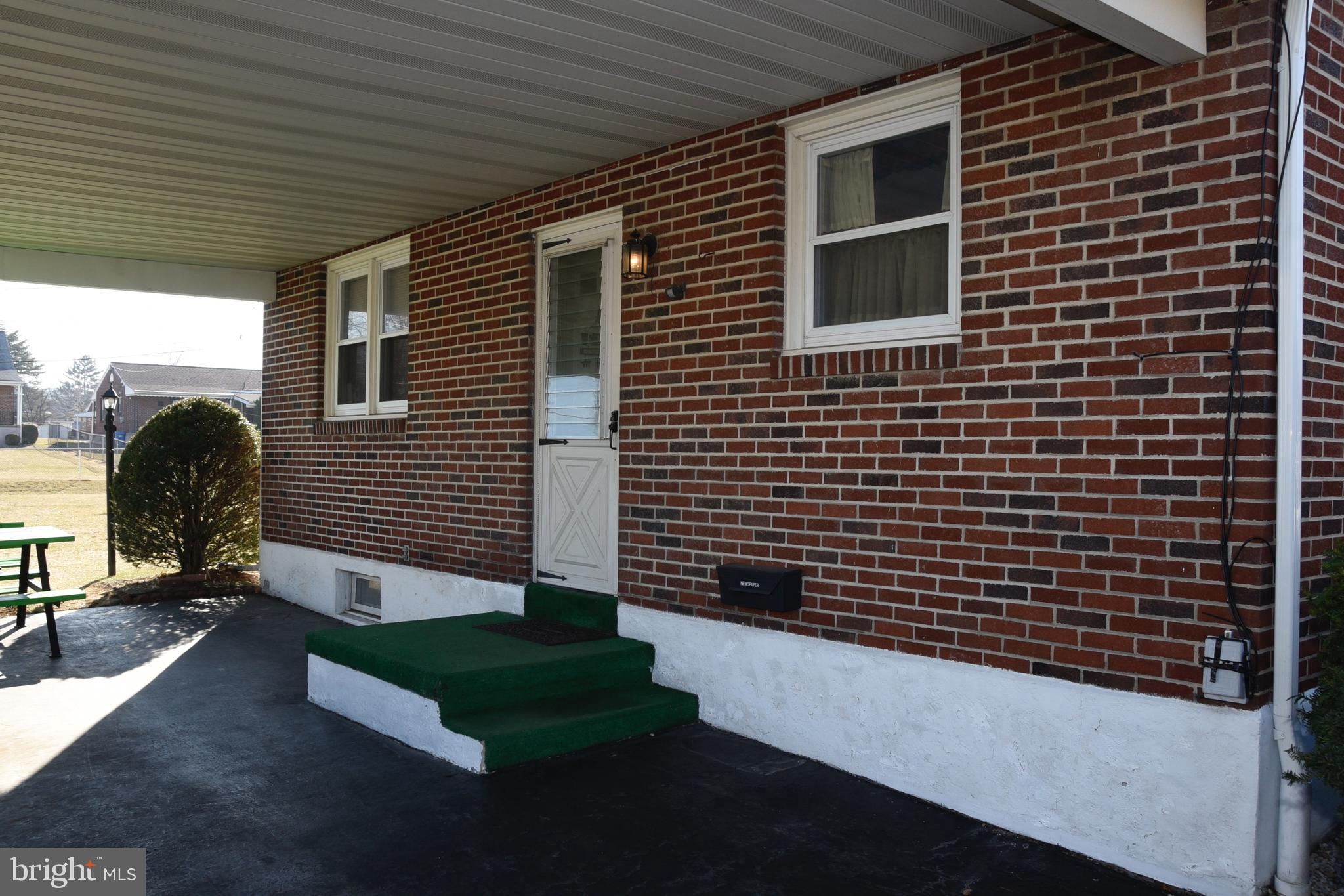 4013 5th Avenue Temple, PA 19560 - Photo 19 of 23 a front view of a house with a yard