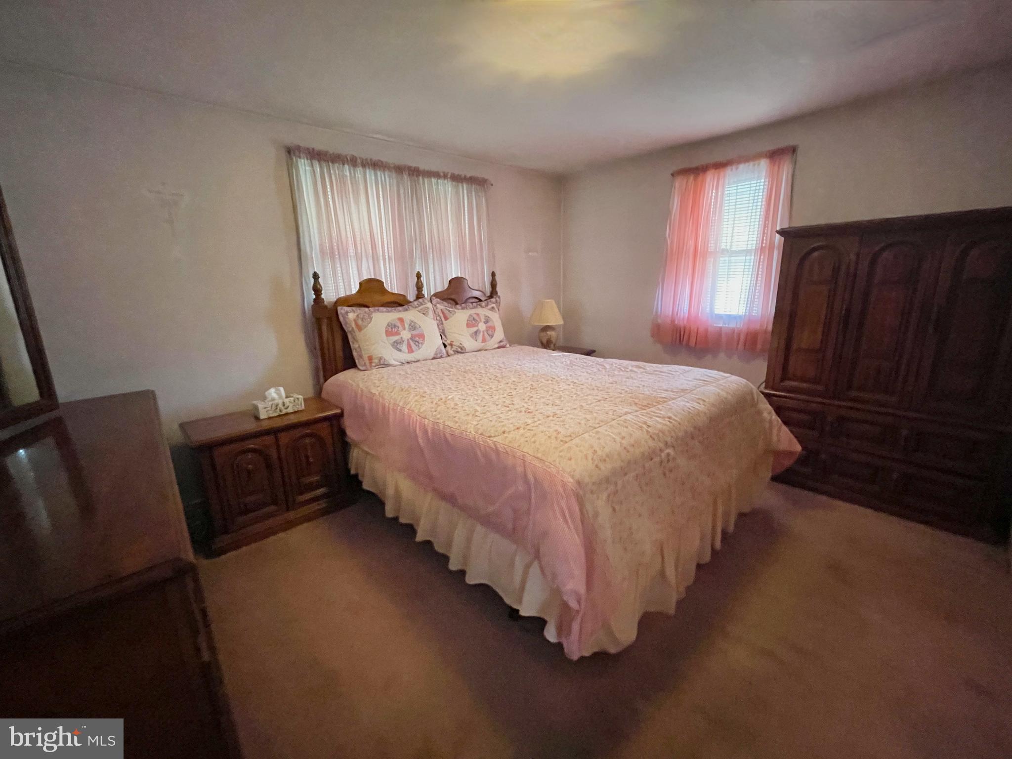 4013 5th Avenue Temple, PA 19560 - Photo 8 of 23 a bedroom with a bed and wooden floor