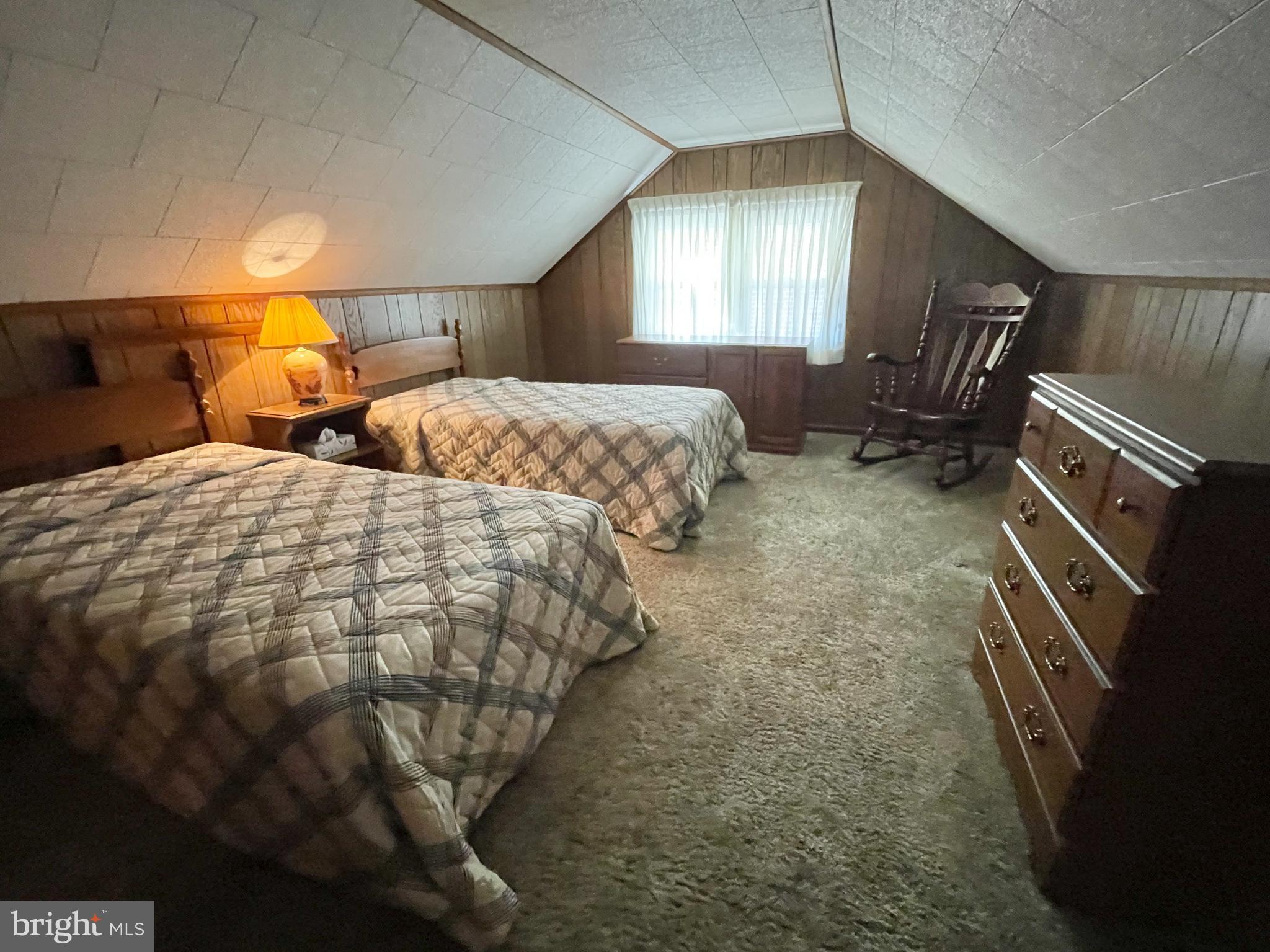 4013 5th Avenue Temple, PA 19560 - Photo 9 of 23 a spacious bedroom with two beds and a chandelier