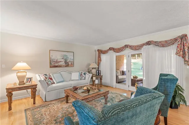 a living room with furniture and a lamp