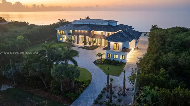 a view of a big yard next to a lake