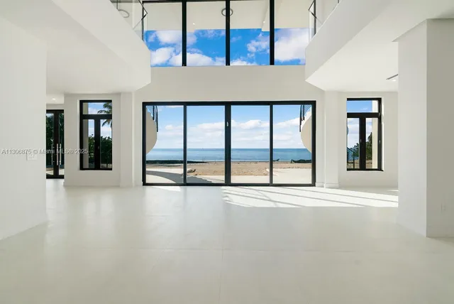 a white tub sitting next to a shower